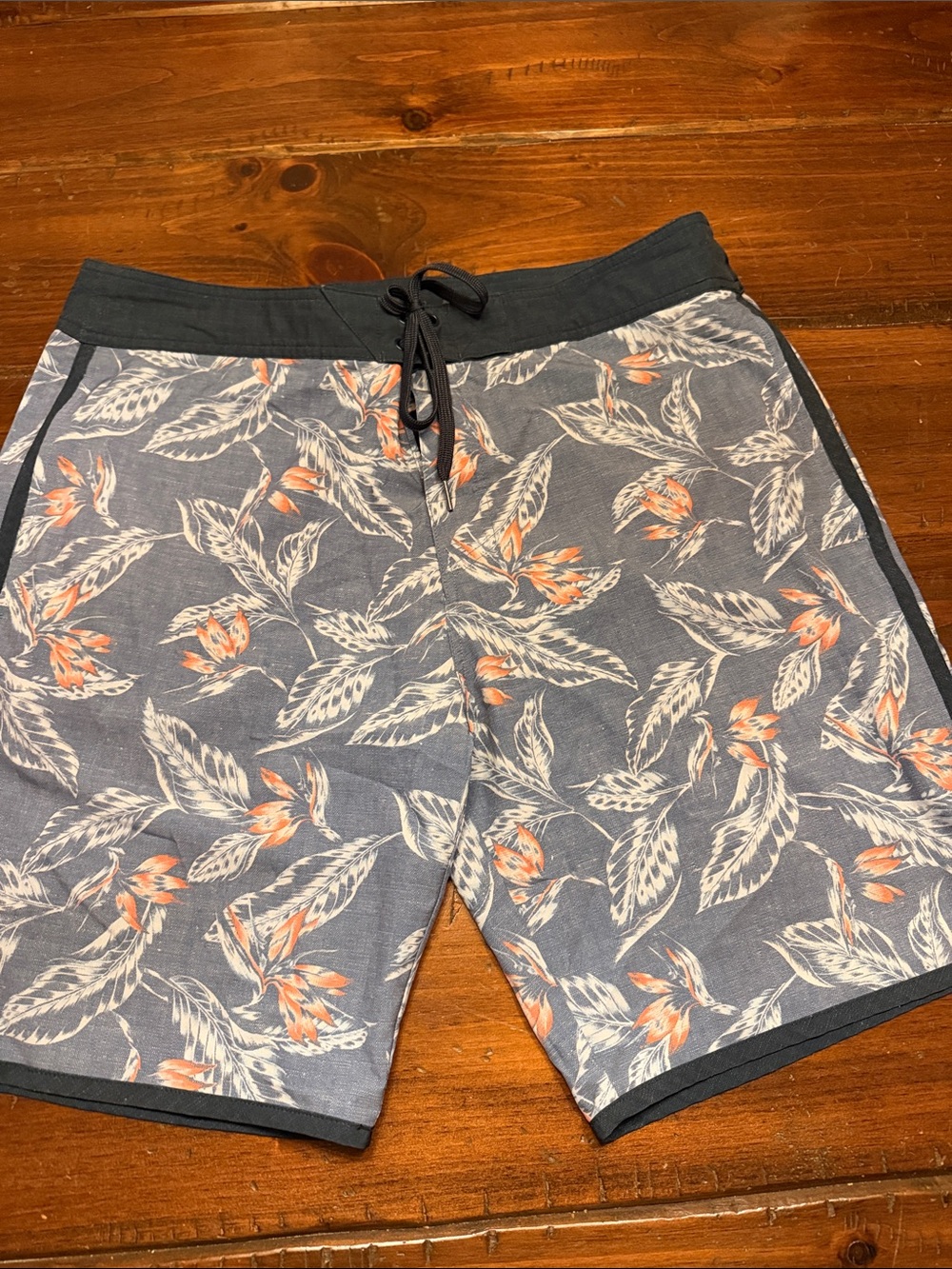 Travis Mathew Blue Floral Swim Board Shorts with Orange Accents